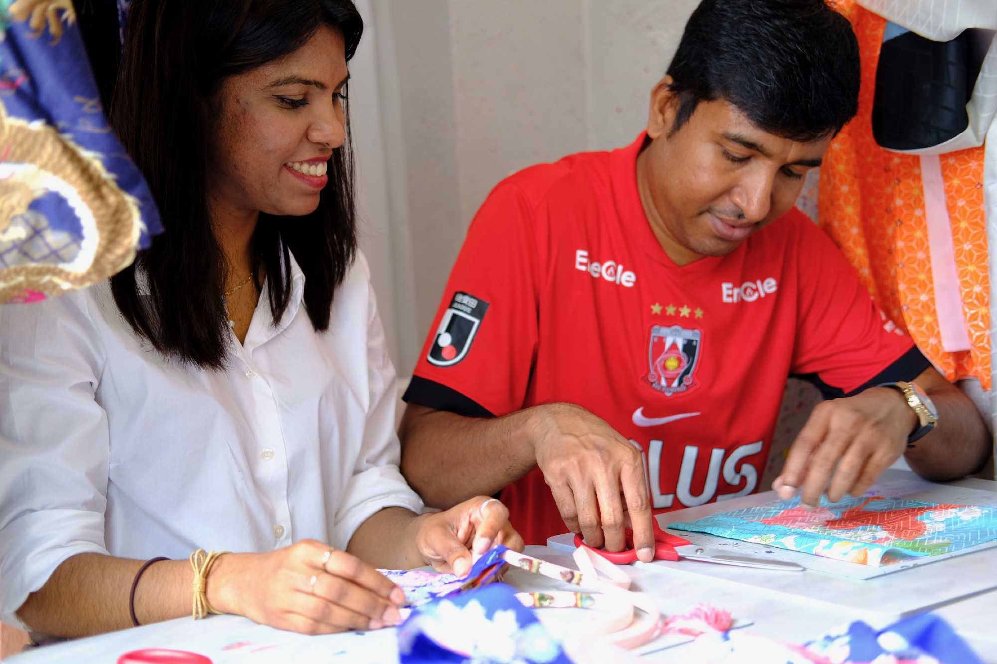 A couple enjoying the hands-on kimono craft workshop